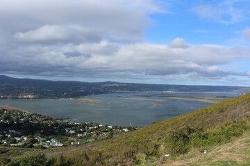 Fototapeta na wymiar Landscape with cloudy sky - the town Knysna in Western Cape seen from a hill
