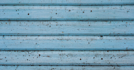Texture of wooden boards, blue background.