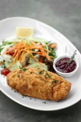 chicken cordon bleu meal with salad in french restaurant