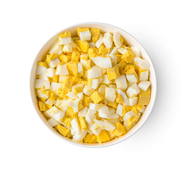 Boiled eggs diced in a bowl isolated on a white background.