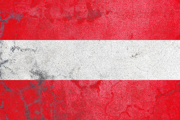 Distressed austria flag on an old abandoned concrete wall surface
