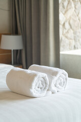 Fototapeta na wymiar white towel on bed in bedroom