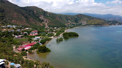 The popular beach spot of Metiaut with beautiful views of ocean, mangroves, and hilly landscape in Dili, Timor Leste