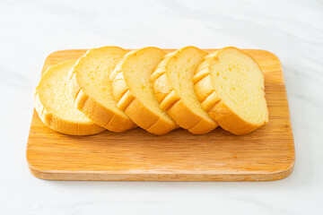 potatoes bread sliced on wood board