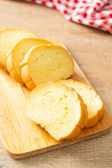 potatoes bread sliced on wood board