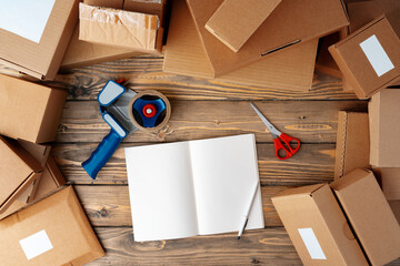 Packing products for delivery on wooden table, top view