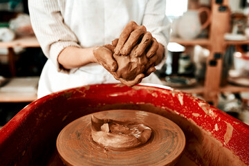 Ill never let go of my love of clay. Cropped shot of an unrecognizable woman molding clay on a pottery wheel.