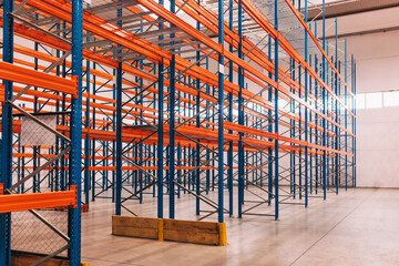 Fototapeta na wymiar Interior of a modern warehouse, pallets on the floor.