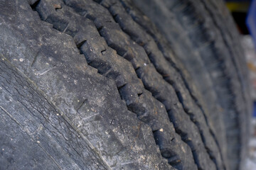 close up of an old tire. Transportation infrastructure. Transport detail. Background