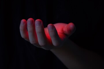 The palm from which it emits red light. Magical abilities and activation of energy in the body.Red light on the palm. Heat entering the body. Magical abilities, enchantment and spirituality.