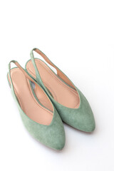 Female shoes in delicate mint color on a white background