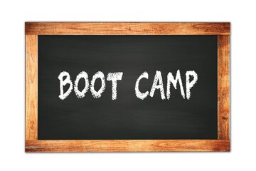 Fototapeta premium BOOT CAMP text written on wooden frame school blackboard.