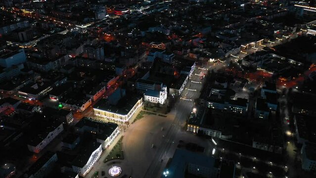 Brest, Belarus. Top View Of Cityscape Skyline City In Night Illuminations. Aerial View Of Lenin Square, Lenin Street, Stadium In Evening Illumination.