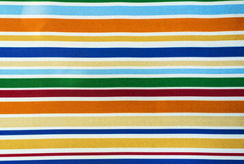 Fabric with colored stripes. Texture of striped fabric with multicolored stripes