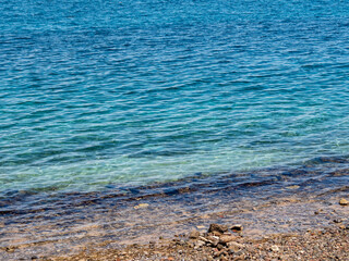 Beautiful exposed stone seashore on a sunny day at low tide.