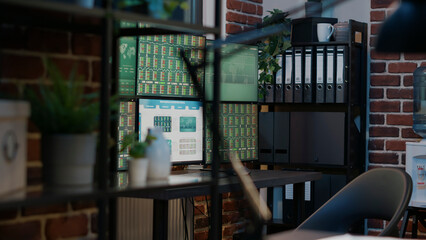 Nobody at empty desk with multiple monitors sharing financial sales on stock market trade exchange. Global statistics about forex profit to buy and sell capital money, buying trend.