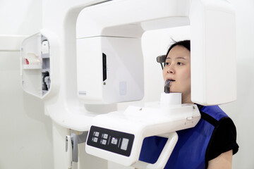 Young woman patient make a dental computer tomograph.