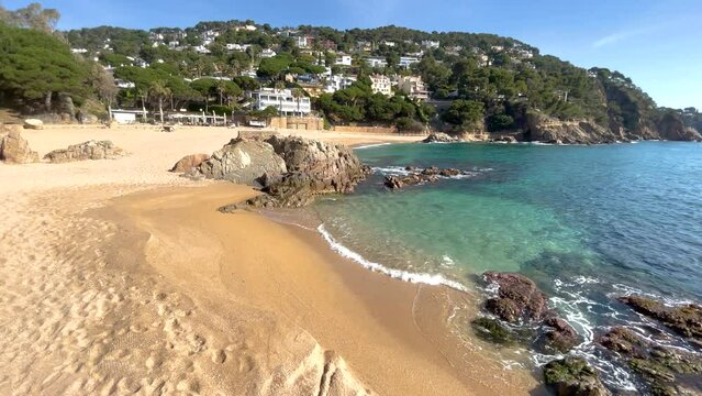 Catalonia Costa Brava beach cala Sant Francesc mi gente Mediterranean sea water transparent greenish blue luxury urbanization background