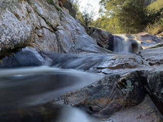 River racing over rocks and creating a waterfall