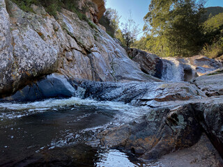 River racing over rocks and creating a waterfall