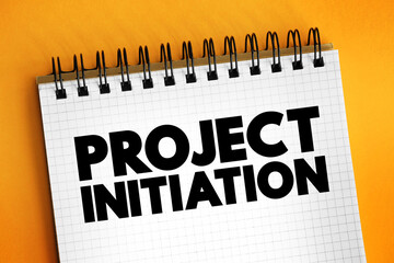 Project initiation - first step in starting a new project, text concept on notepad for presentations and reports - obrazy, fototapety, plakaty