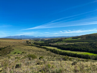 Rolling green mountains and hills on a sunny day