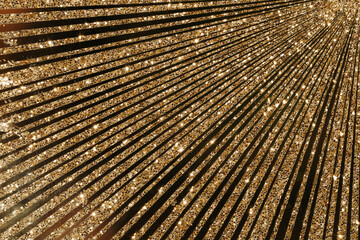 golden starburst sequin background for christmas and new year holiday beauty products presentation. Beautiful luxury quality marketing