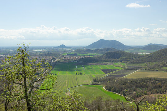 Hilly landscape. Trail on Monte Ceva. Aerial view of the Terme Euganee, Padua and the cultivated fields. Green spring landscape.