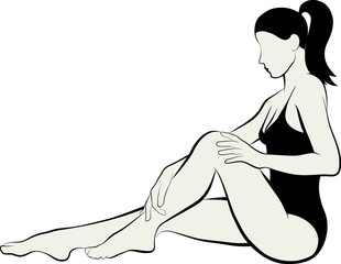 young woman massaging her leg