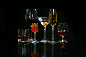 several types of cocktail on a black background