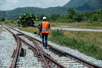 engineer sitting on railway inspection. construction worker on railways. Engineer work on...