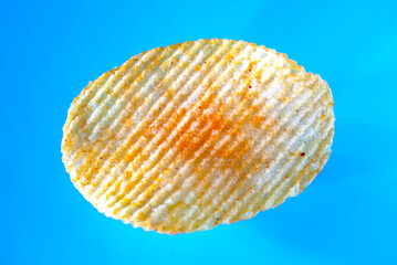 potato chip on blue background