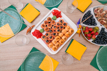 Decorated catering banquet table with different food appetizers assortment on a party