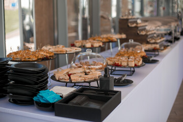 Decorated catering banquet table with different food appetizers assortment on a party