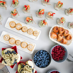 Decorated catering banquet table with different food appetizers assortment on a party