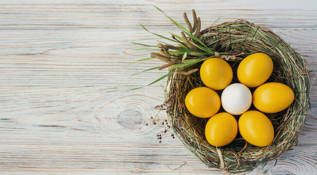 Easter background with yellow red Easter eggs. Top view with copy space