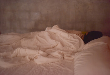 Blurred women sleeping on white bed.