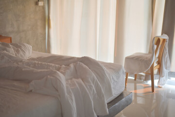 Blurred women sleeping on white bed.