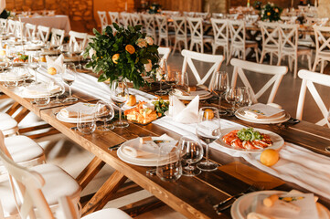 original serving of the festive table with decorative tangerine trees