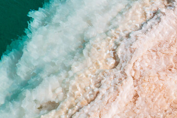 Natural Salt water lake in desert. Oasis in Siwa, Egypt. Tourism spot in Egypt. Closeup turquoise water and white salt
