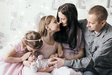 happy family with a pretty newborn baby .