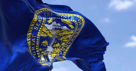The US state flag of Nebraska waving in the wind.