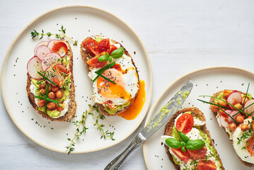 Vegetarian egg sandwiches on white background.. Healthy vegetarian sandwiches with egg tomatoes...