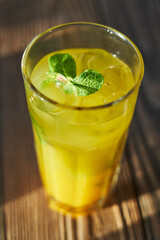 glass of fresh mojito with lime on wooden background, a drink close-up, cocktail, lime ,lemon