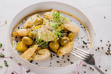 Dietary dish of squids, olives and greens