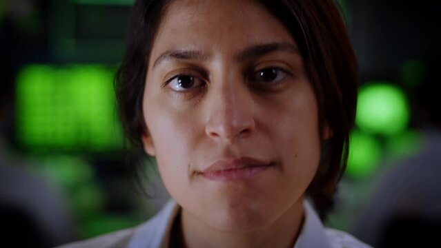 Portrait of Female Medical doctor looking at the camera with serious face. Research woman Scientist in a Biological Applied Science Laboratory. Lab Engineers