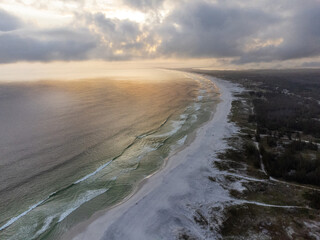 Amazing orange sunset at Arraial do Cabo beach, Rio de Janeiro, Brazil. Aerial drone view.