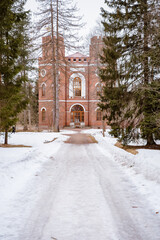 A 19th-century castle in the suburbs of St. Petersburg. An old building with towers in the forest