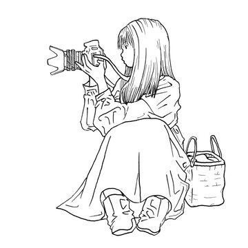 一眼レフカメラで写真を撮るロングヘアの女性