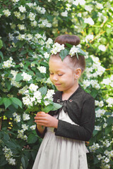 Little girl in Jasmine garden